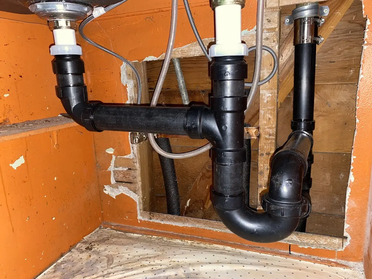 Professional Garbage Disposal Repair equipment and tools on the job in Carolina Shores